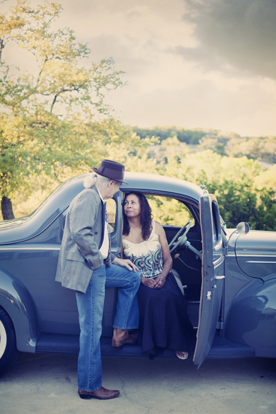 Couple with classic blue car