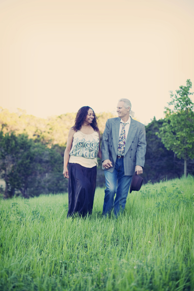 Phil and Dorothee walking in green field